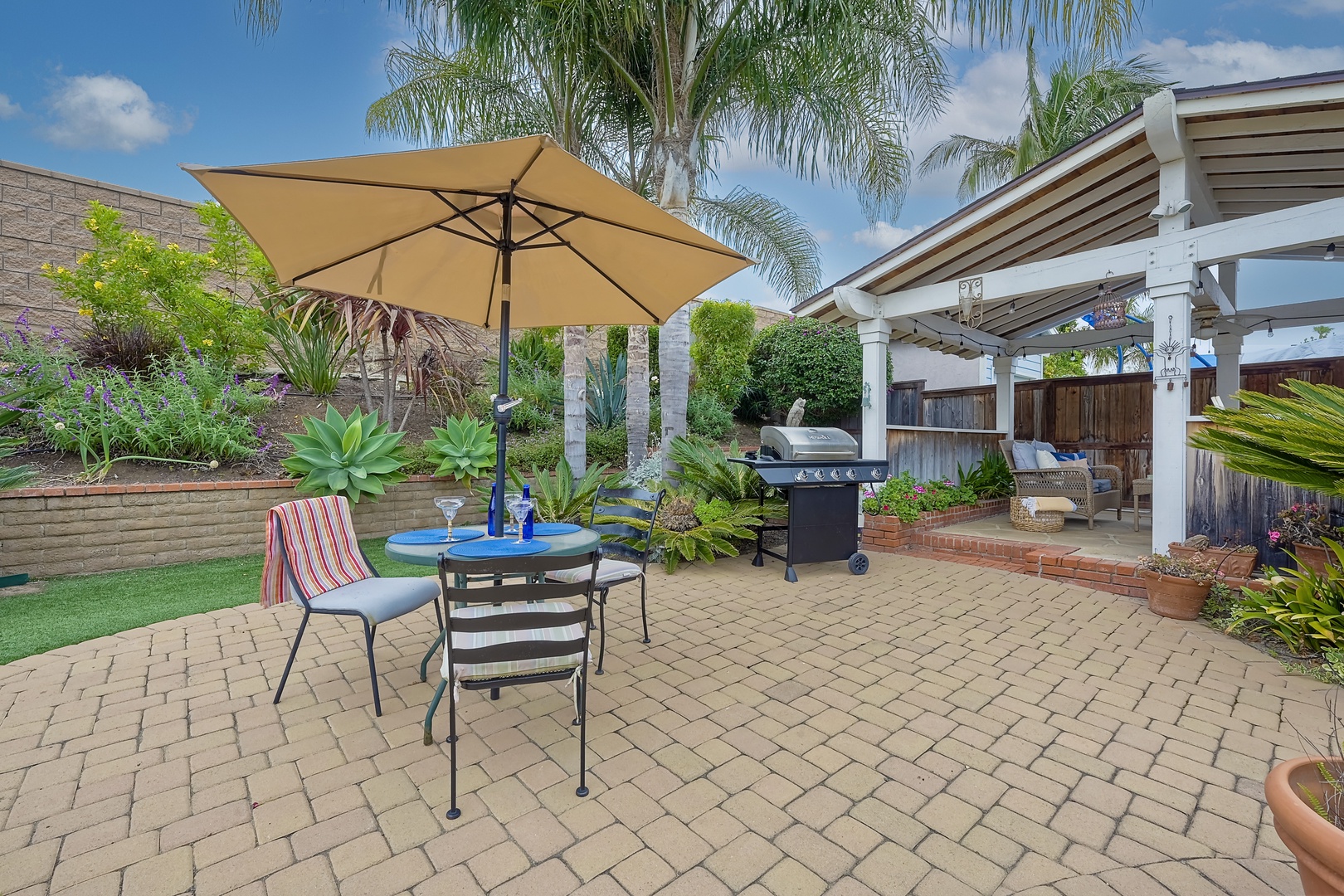 Experience serenity in the backyard oasis, ideal for gatherings & alfresco dining