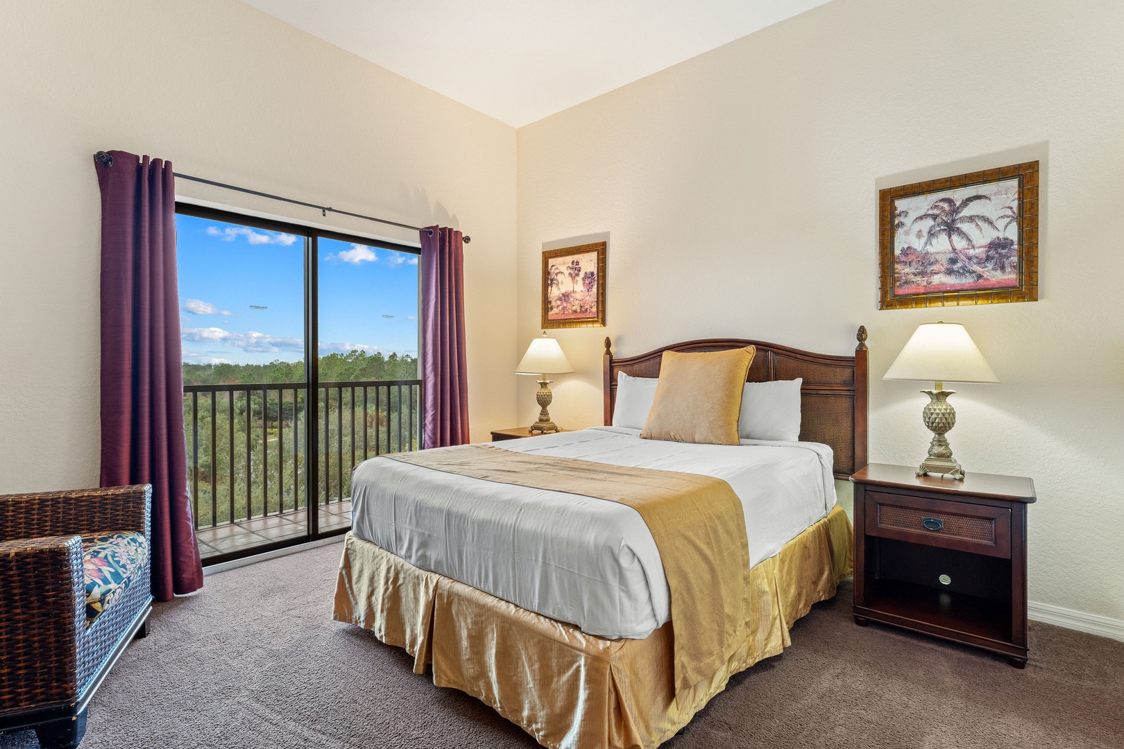 Recharge in the queen bedroom, featuring a TV & balcony access