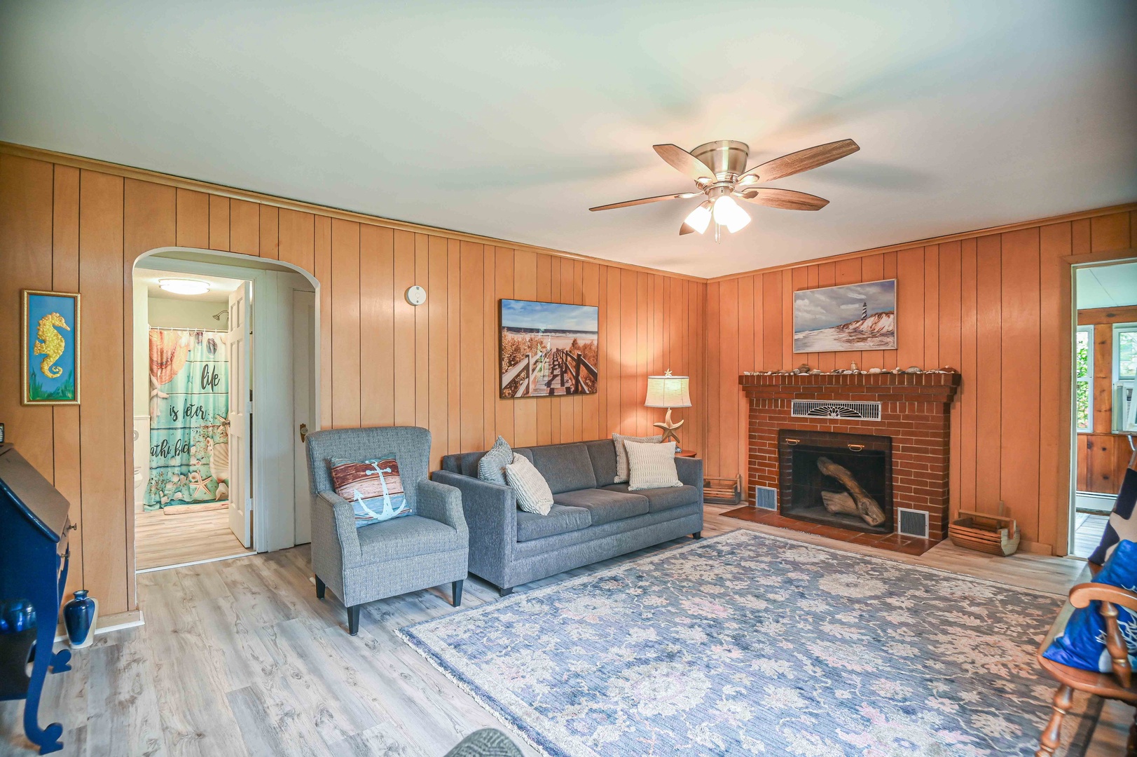 Living room with Smart TV and full size sofa sleeper