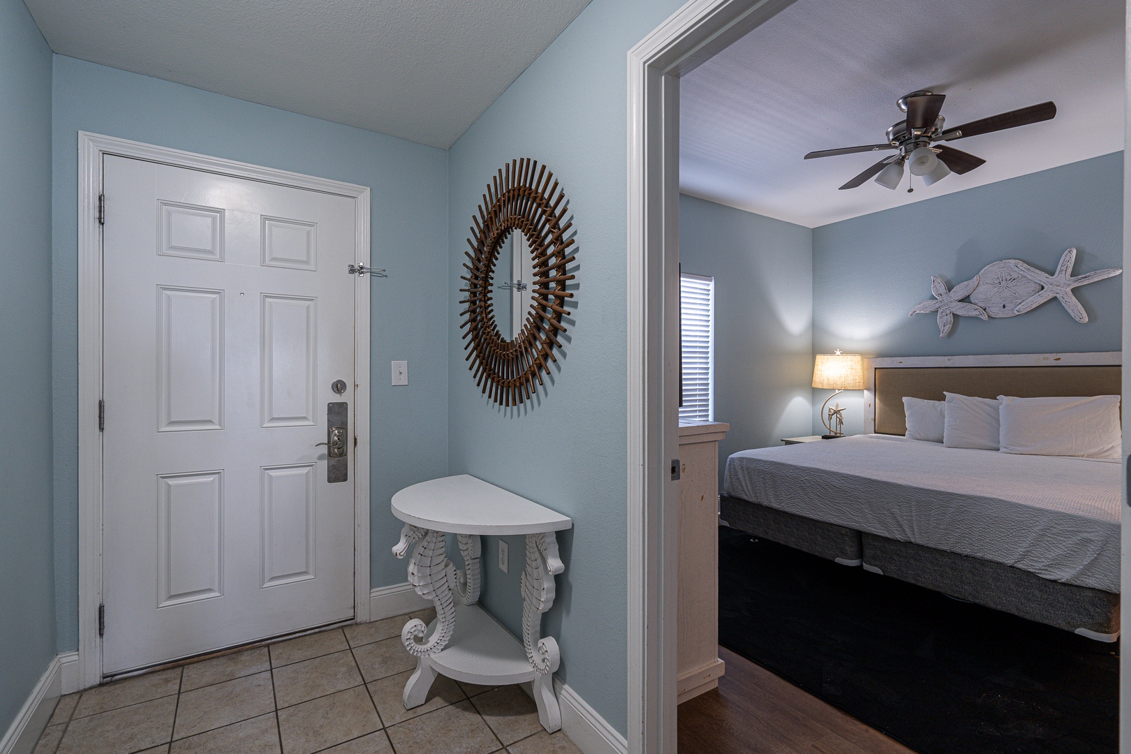 The coastal chic suite boasts a plush king bed, private ensuite, & TV