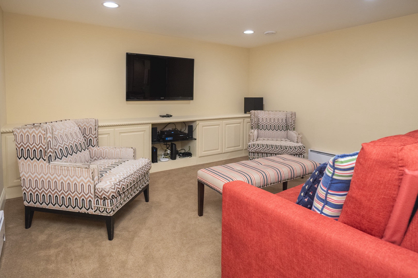 The lower-level family room is ideal for relaxing movie nights