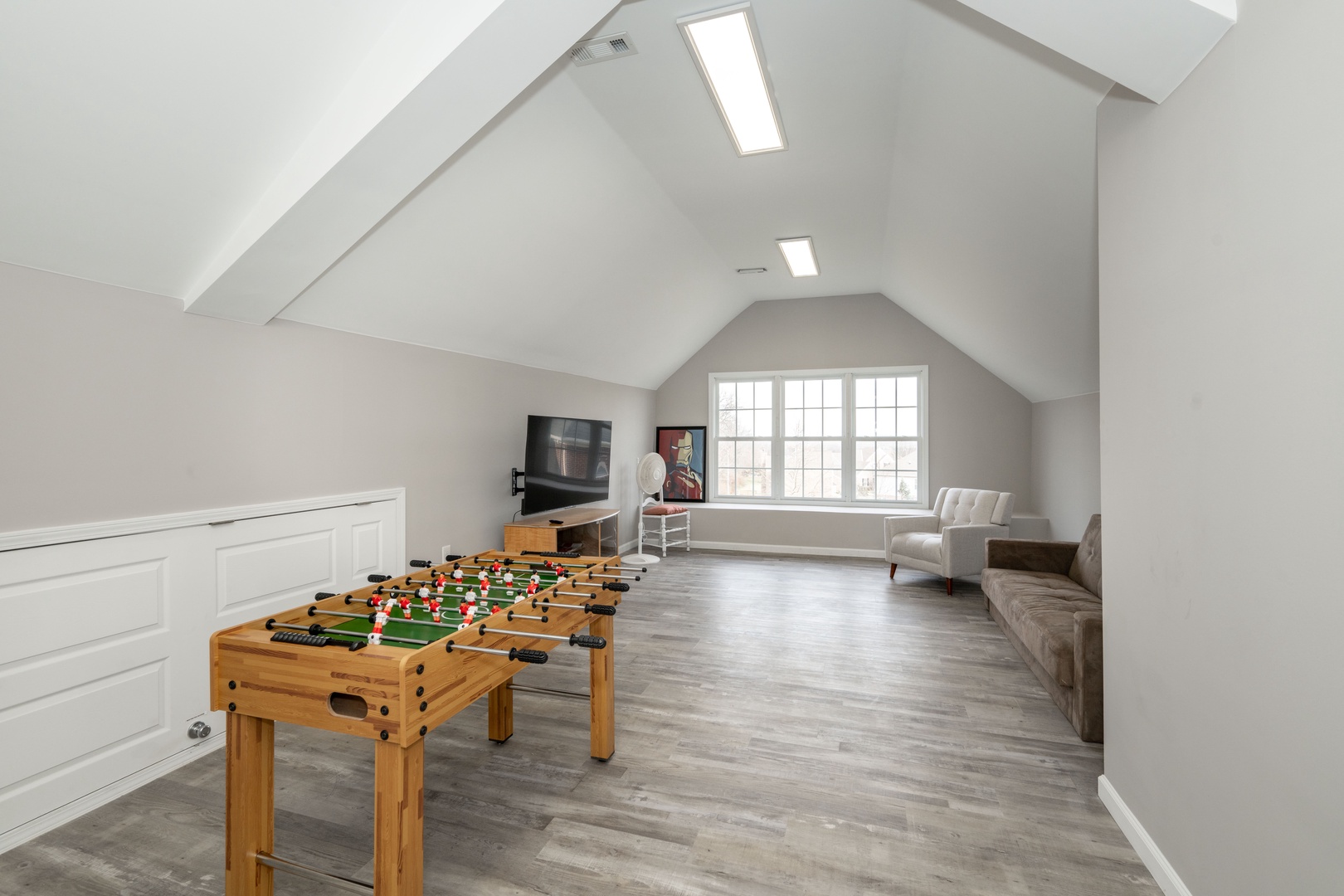 Game room with foosball, board games, Smart TV, and seating area