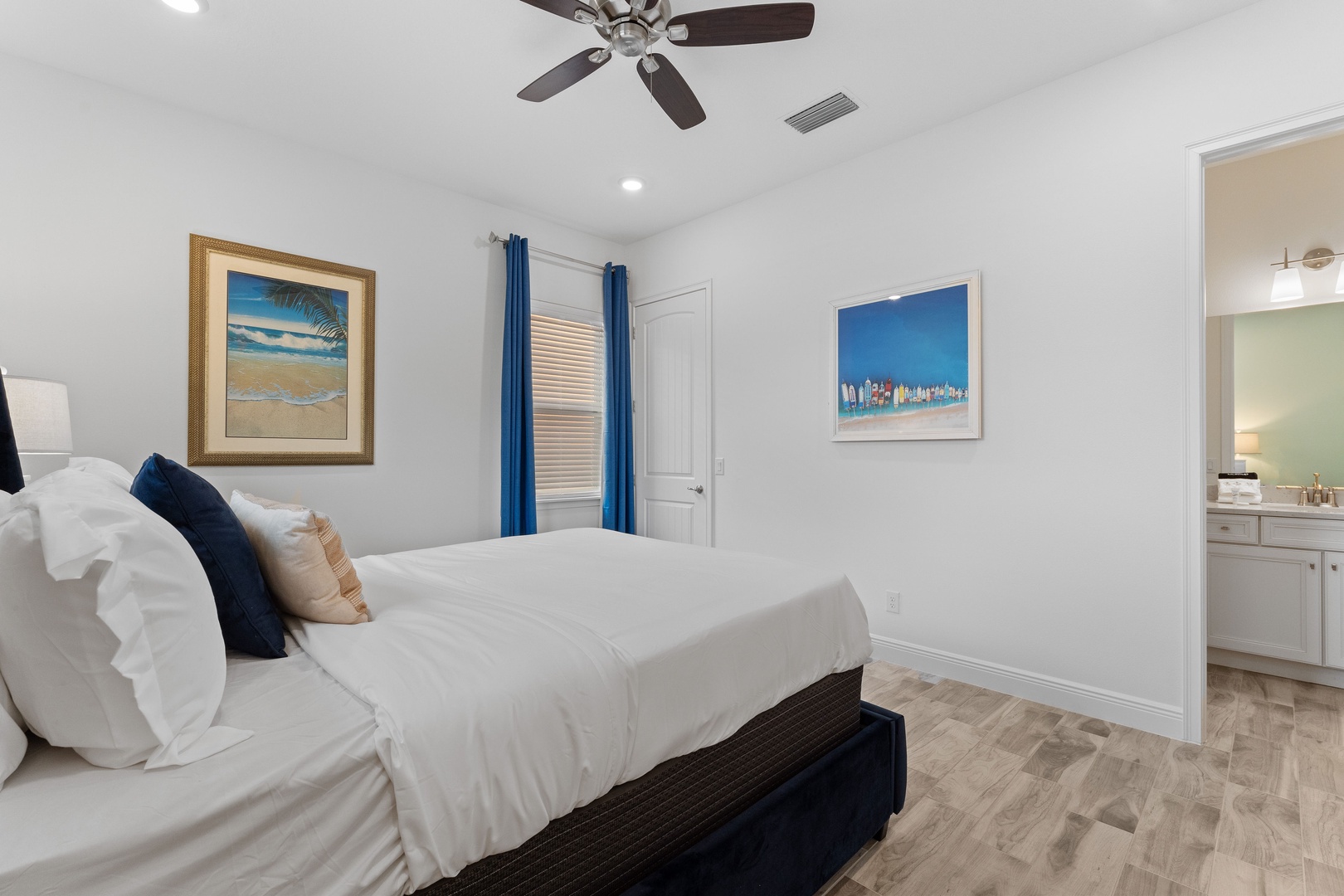 Coastal elegance awaits in this main-level queen bedroom, with ensuite bath