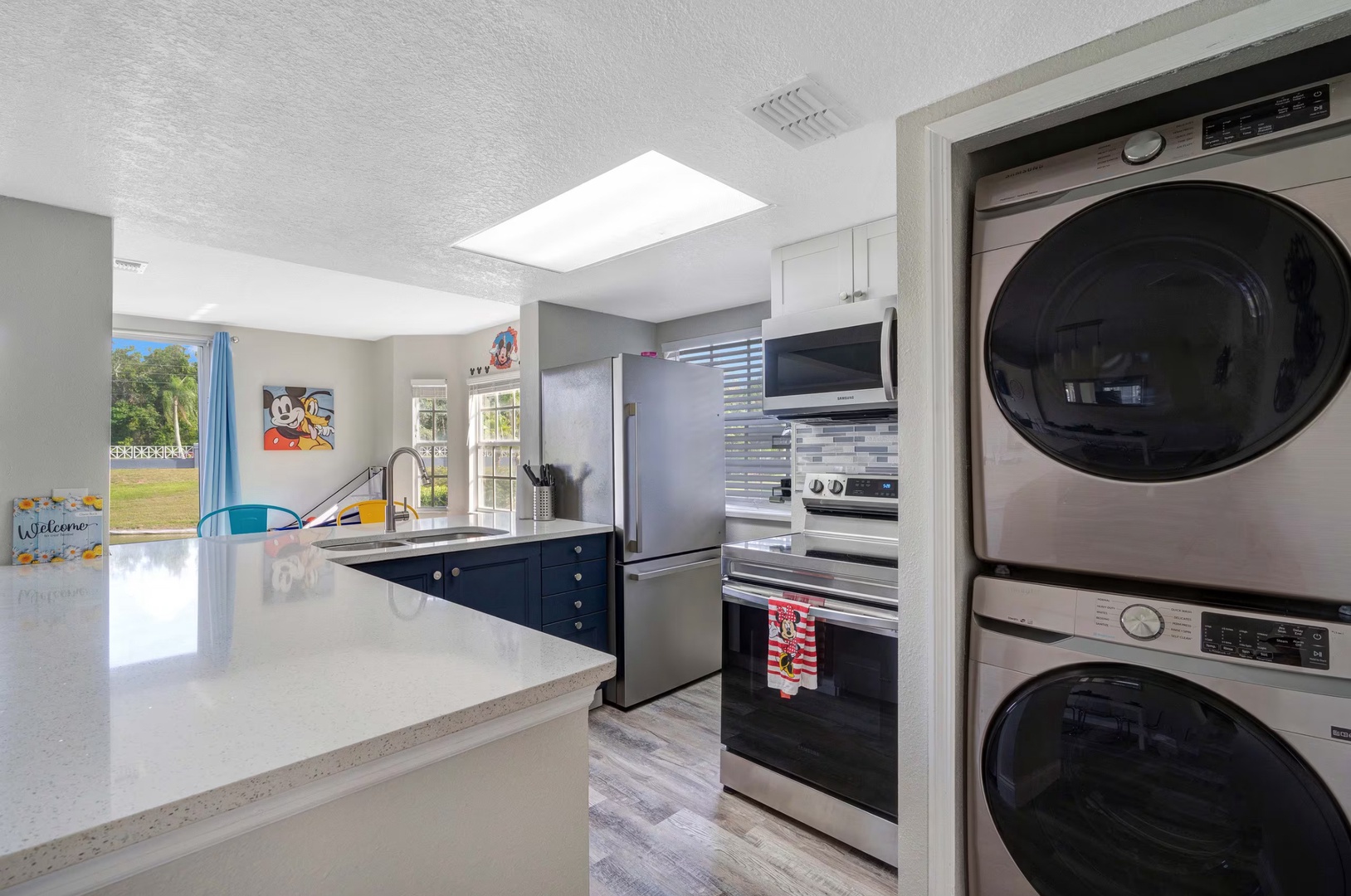 The open, airy kitchen offers ample space & all the comforts of home