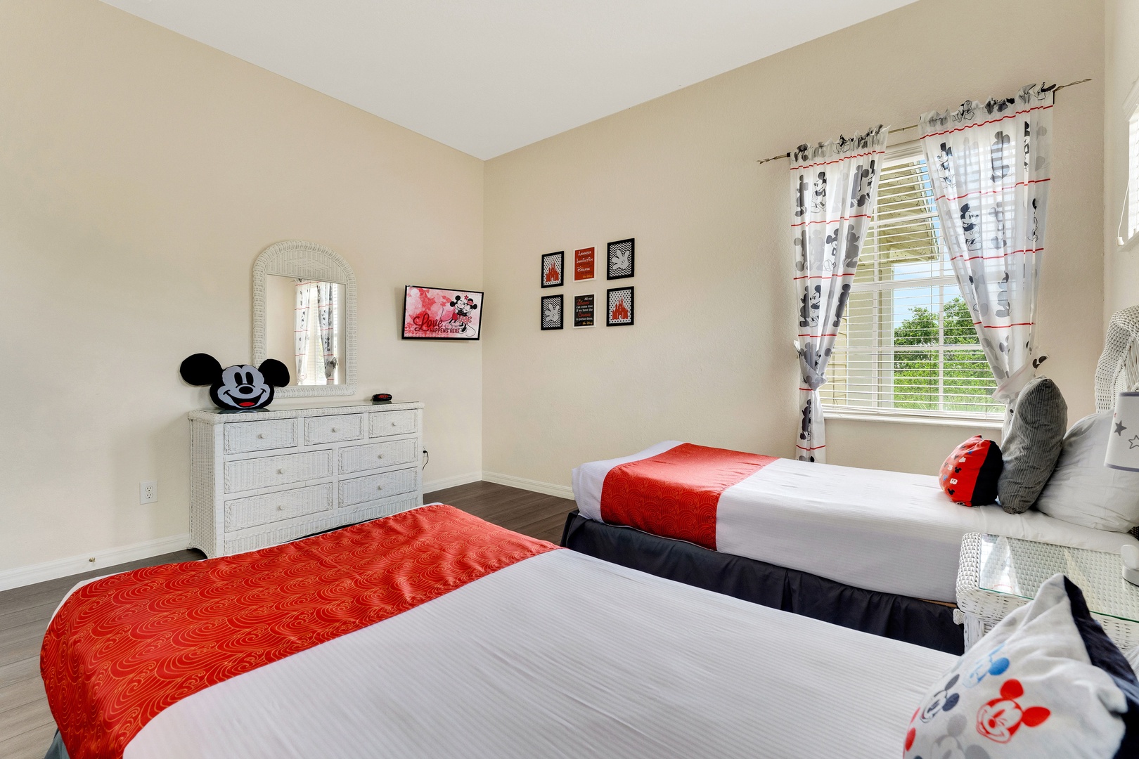 A pair of cozy twin beds & TV await in the final bedroom retreat