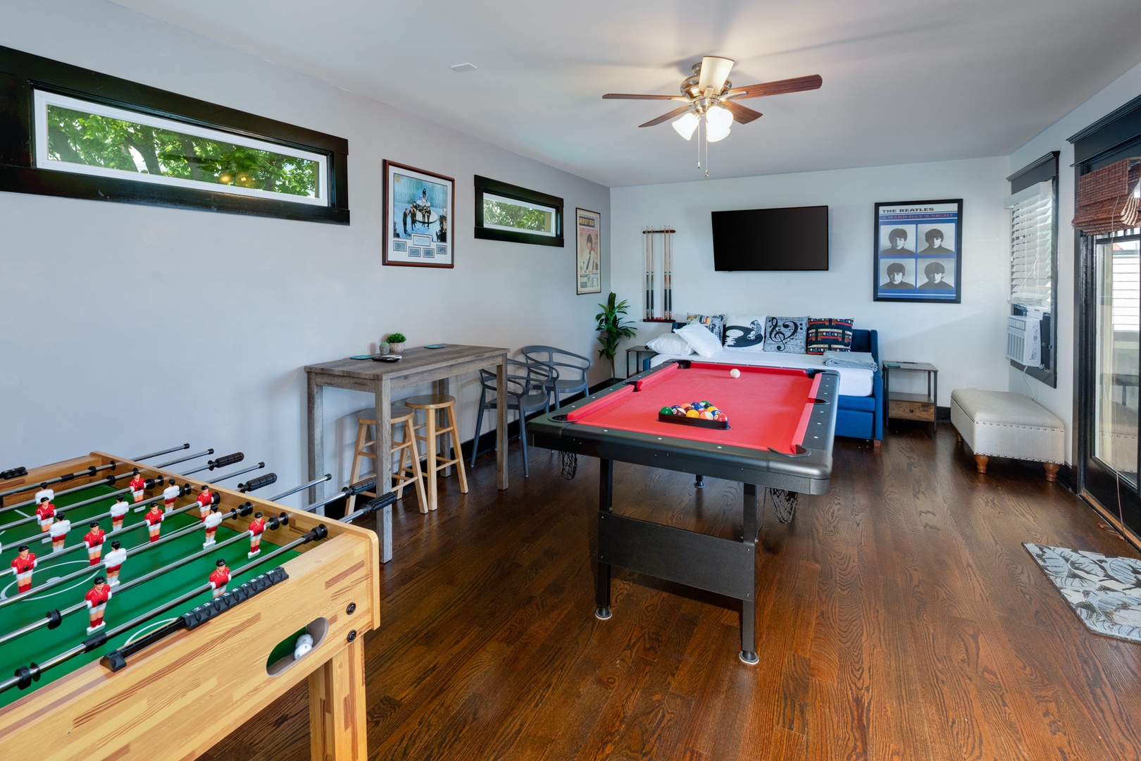 Third Floor Game Room offering Twin Bed & Trundle, Foosball, Pool Table, Smart TV, and Mini Bar Area