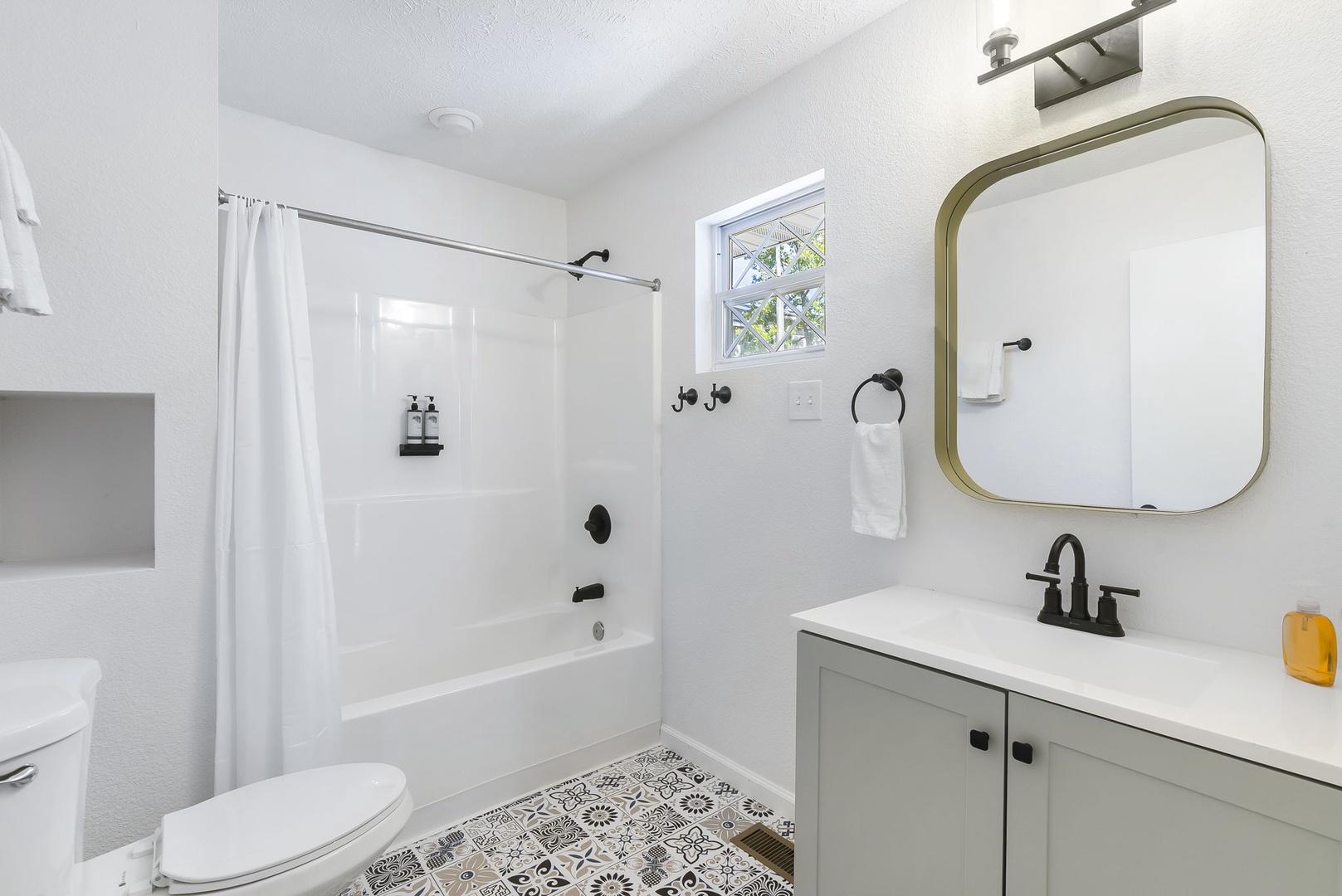 This 2nd floor en suite includes a single vanity & shower/tub combo