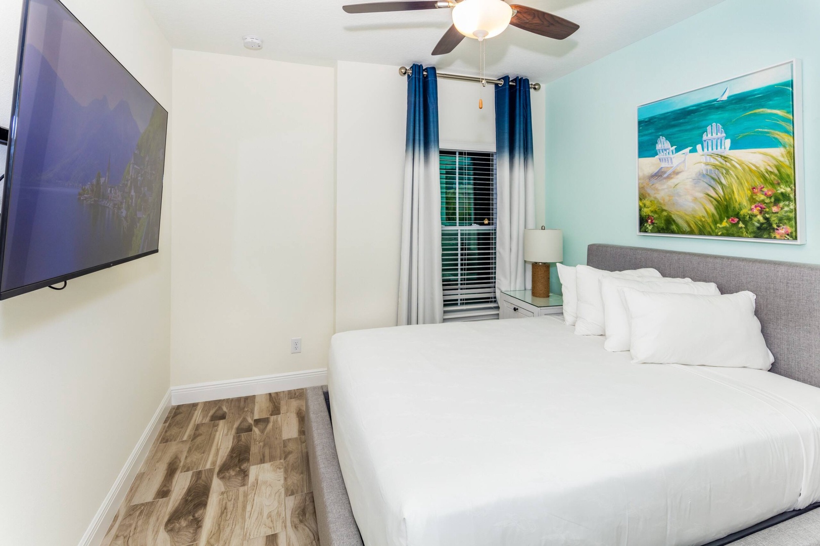 Relax in this Beachy 2nd-floor queen bedroom with smart TV & ceiling fan