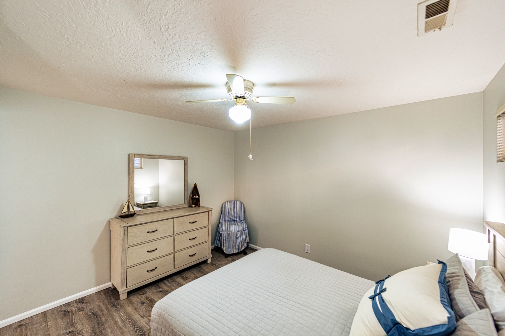 Relax in the peaceful second bedroom with a comfortable queen bed