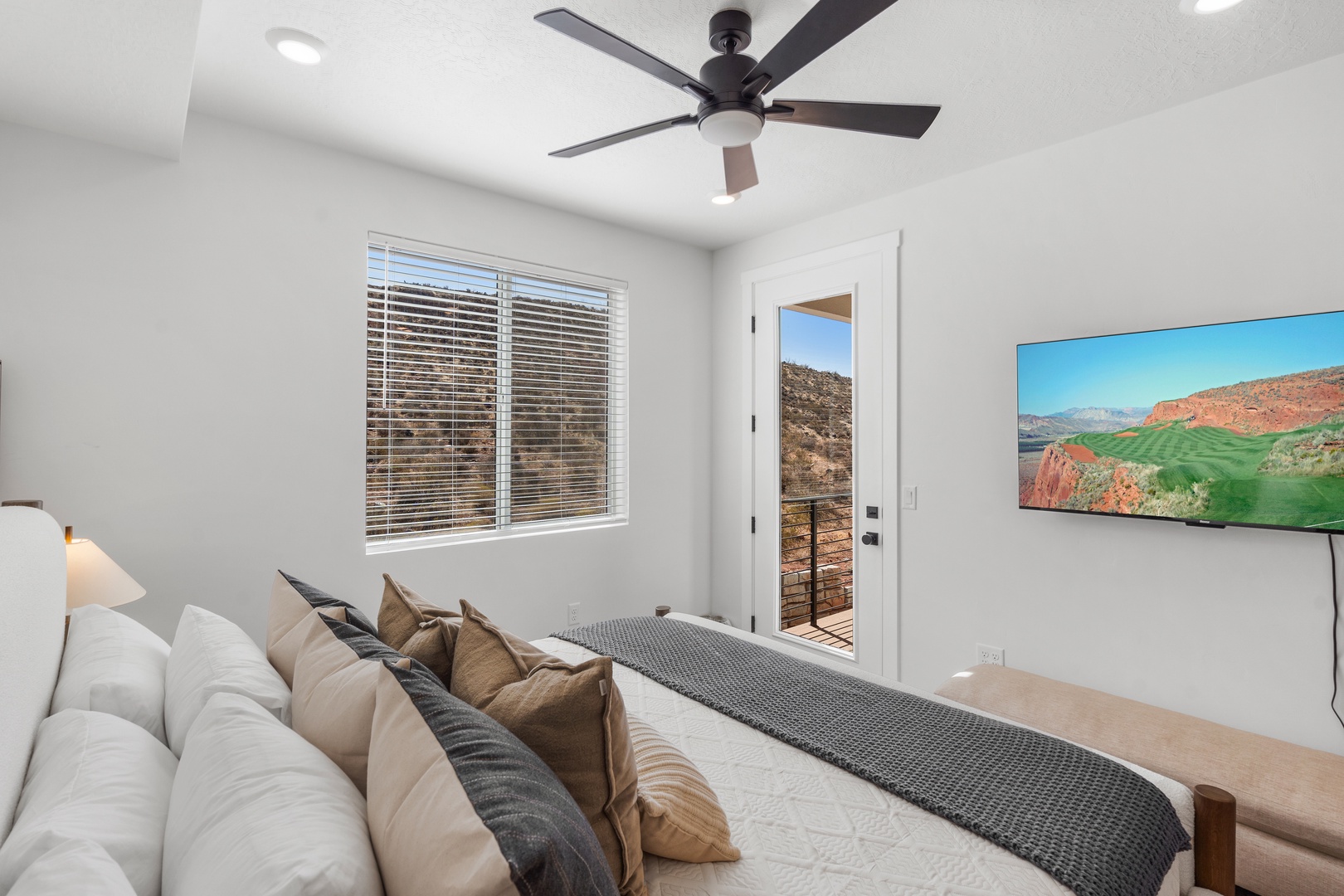 Bedroom 2 with king bed balcony, Smart TV, and ensuite