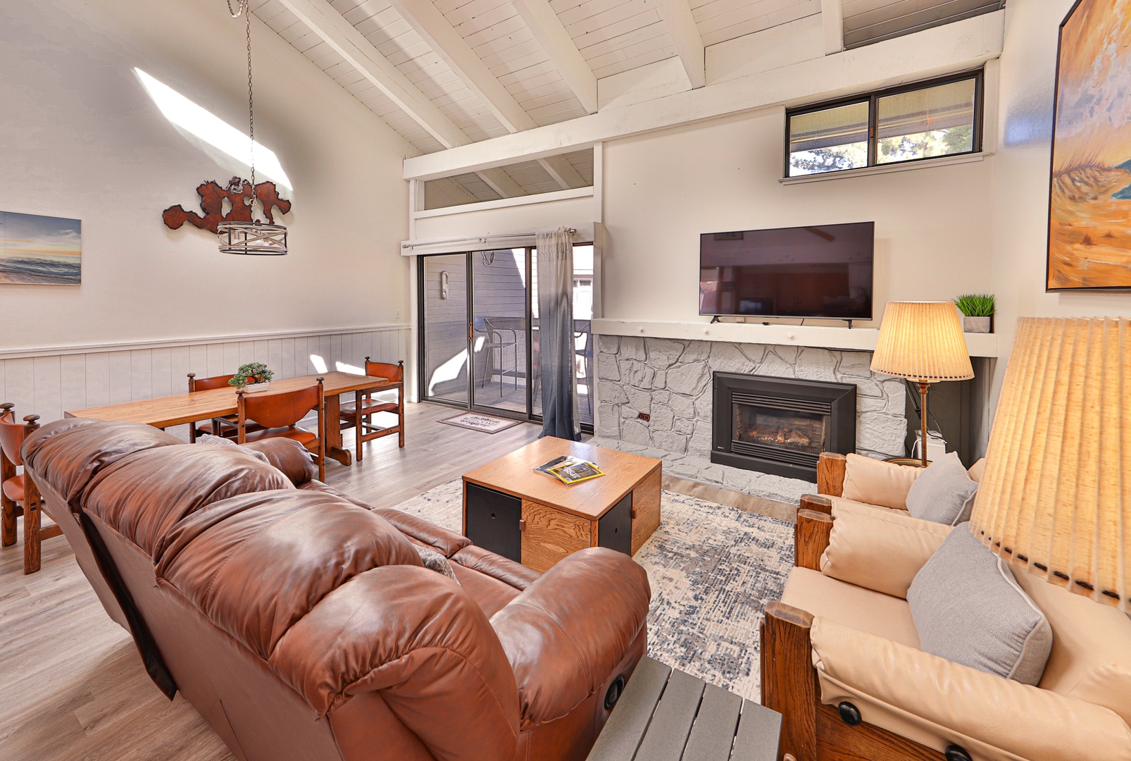 Living room with comfy seating, Smart TV, and fireplace