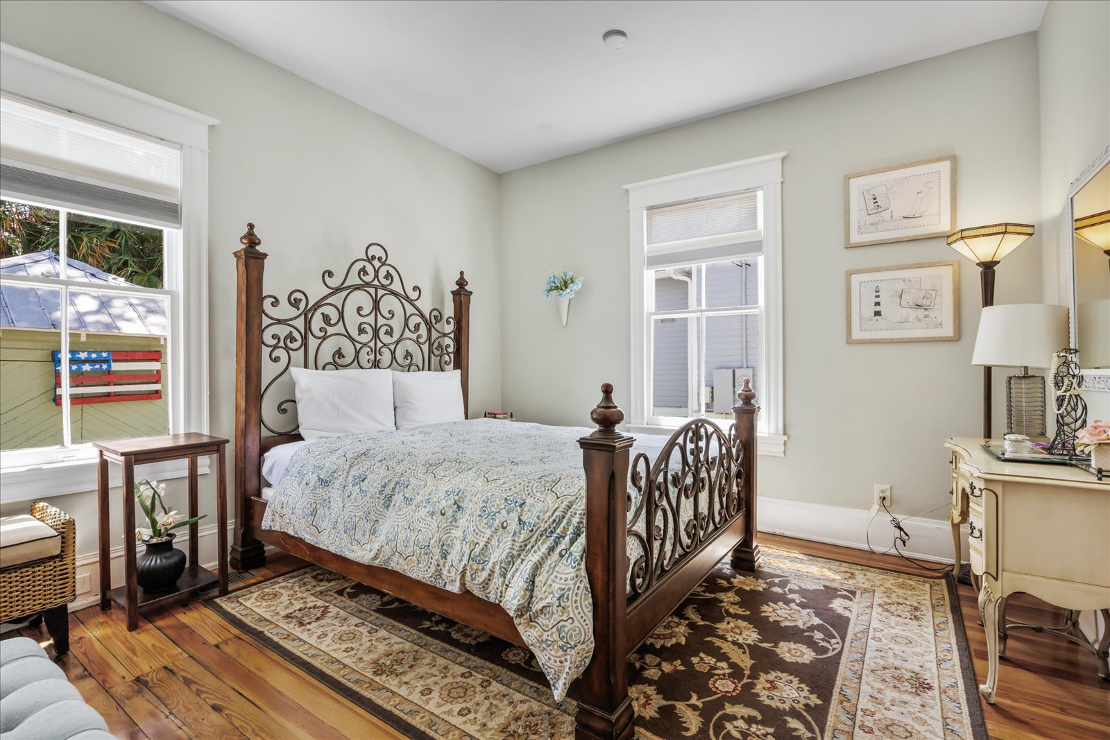 The master bedroom offers a regal queen bed & large windows
