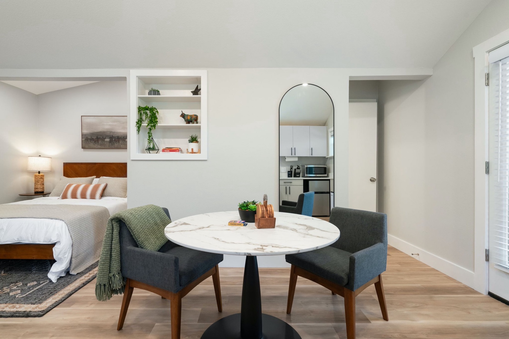 Sip morning coffee or grab a bite at the chic dining table, with seating for 2