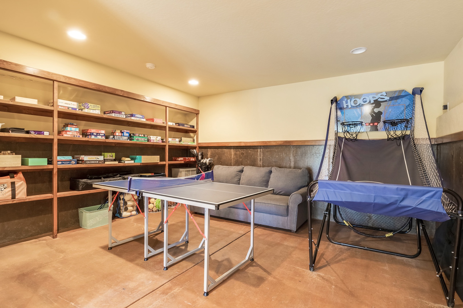 Basement game room with ping pong, board games, and more