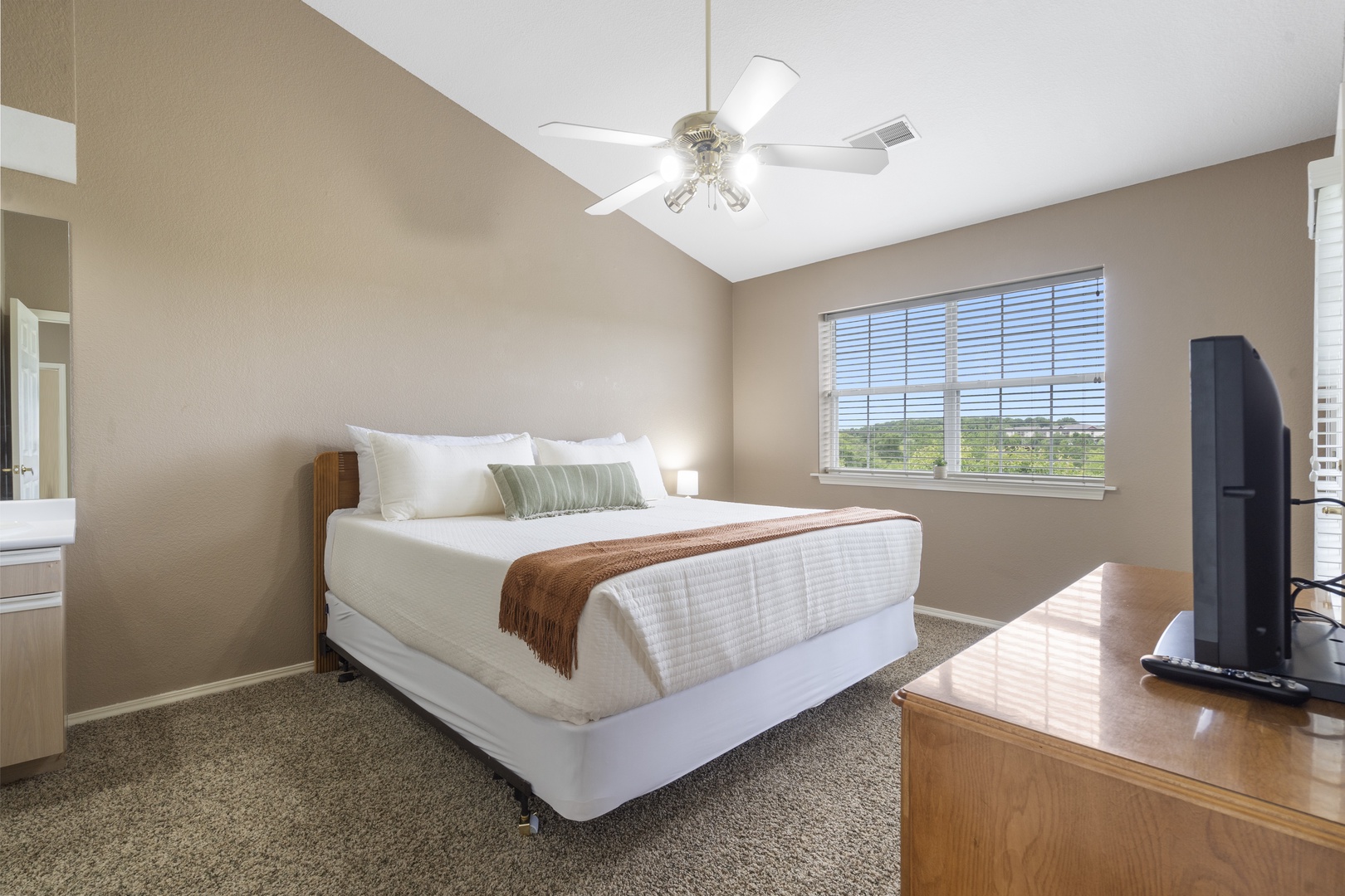 Find natural light during the day in bedroom 4 with King bed