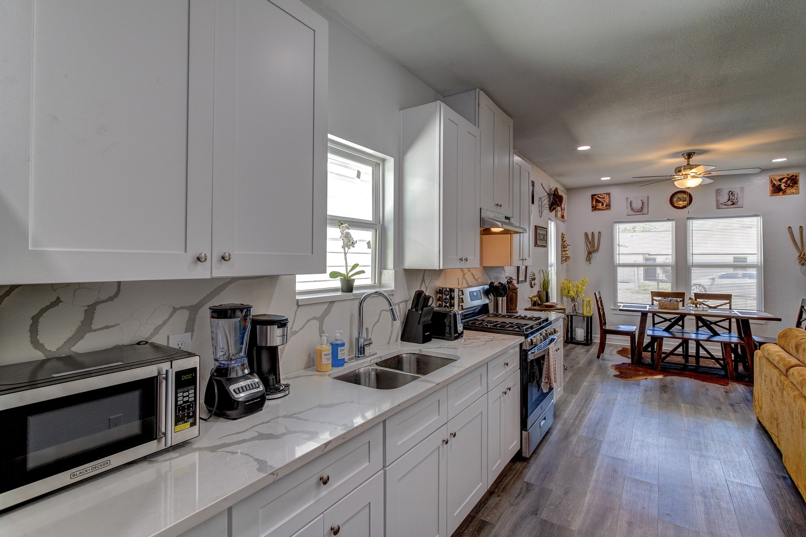 The open, airy kitchen offers ample space & all the comforts of home