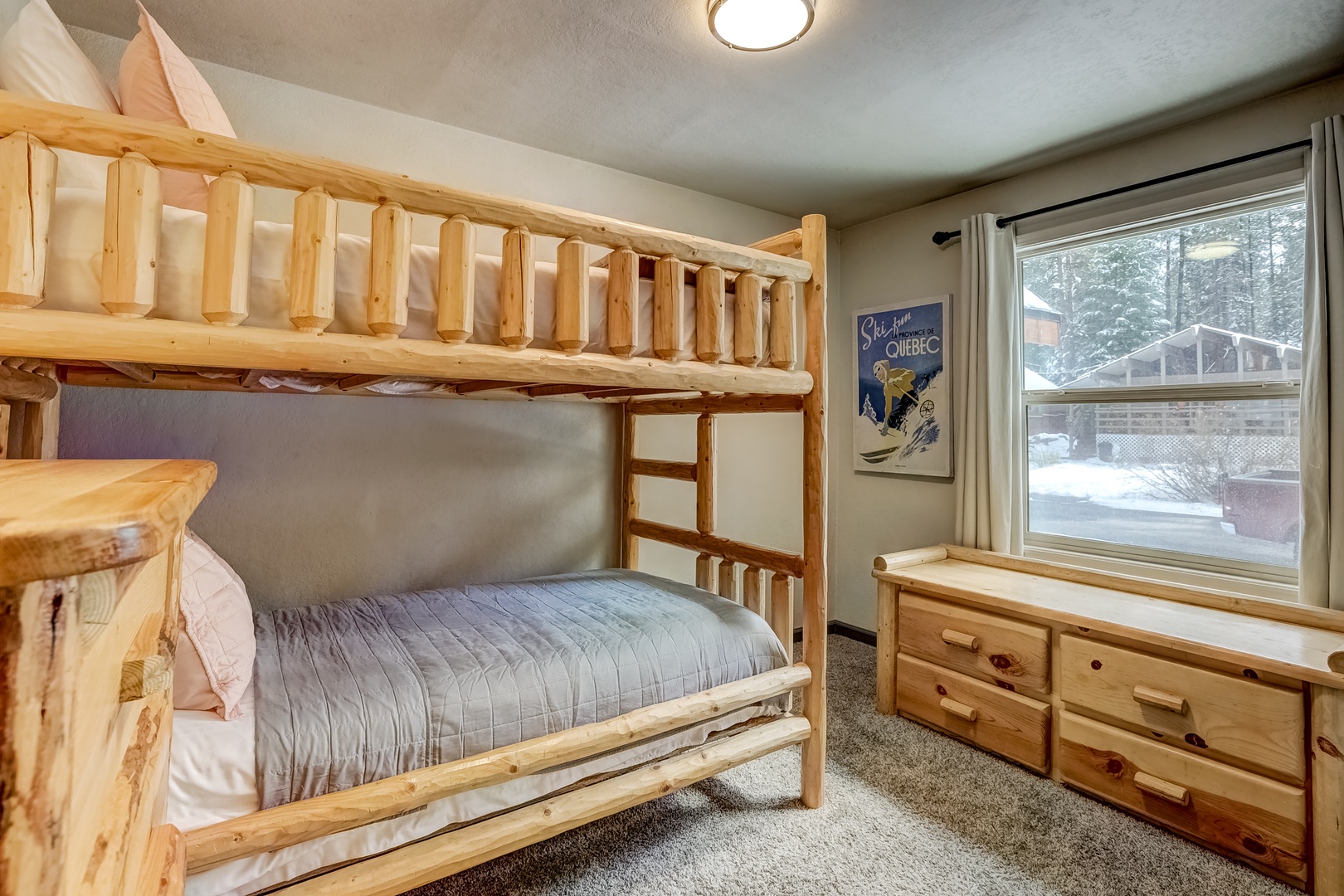 The cabin-style main level bunk room offers twin-over-twin bunks