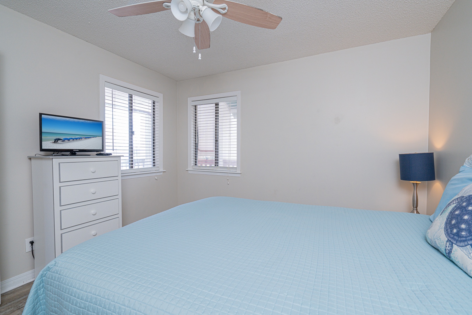 This tranquil lower-level suite features a plush queen bed, ensuite bath, & TV