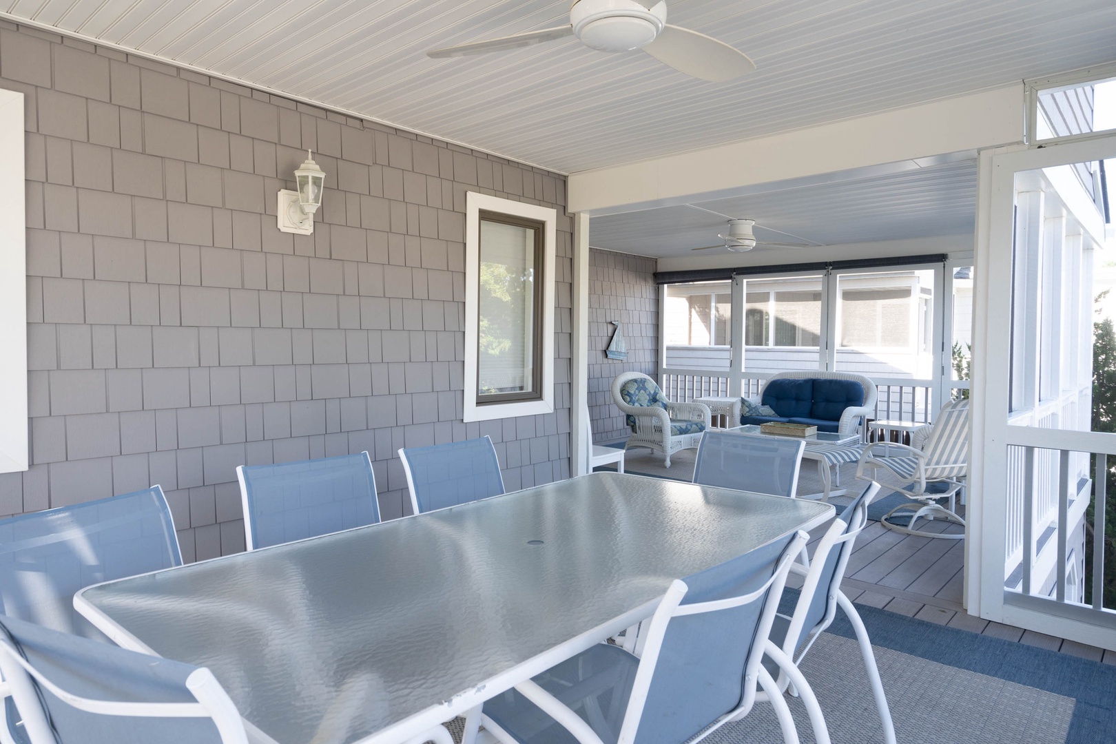 This home’s spacious covered porch offers plentiful seating and an Outdoor Dining Space with seating for 6