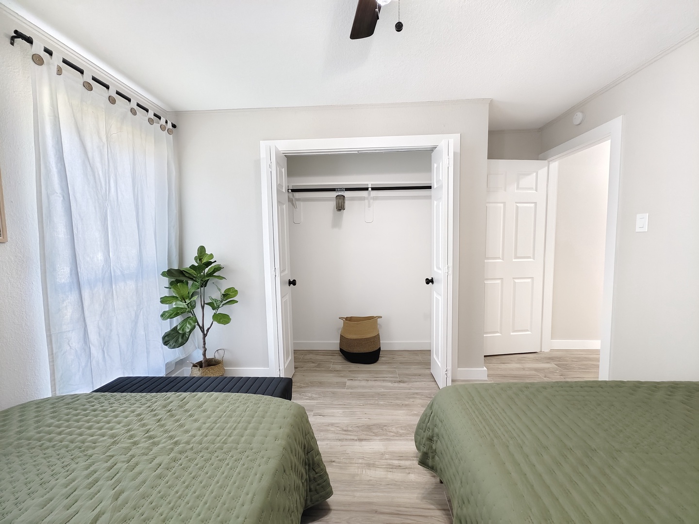 The second bedroom sanctuary features a pair of cozy queen beds