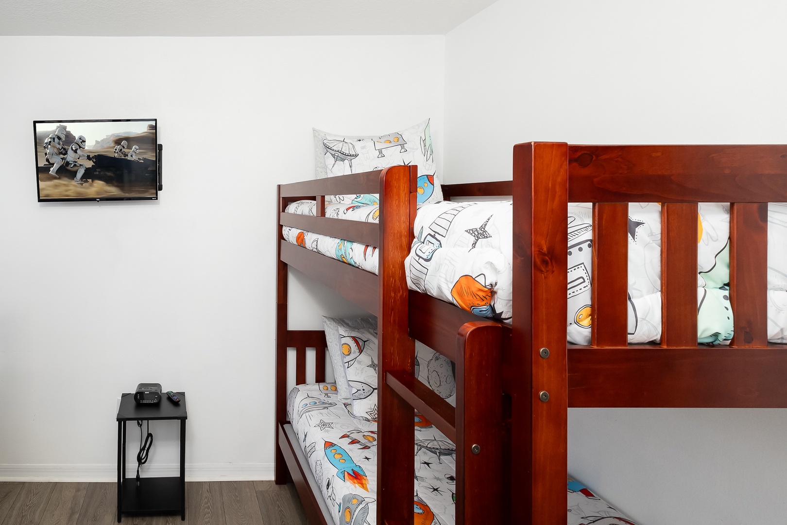 Relax in the cosmic bunk bed retreat, with 2 twin bunkbeds & Smart TV