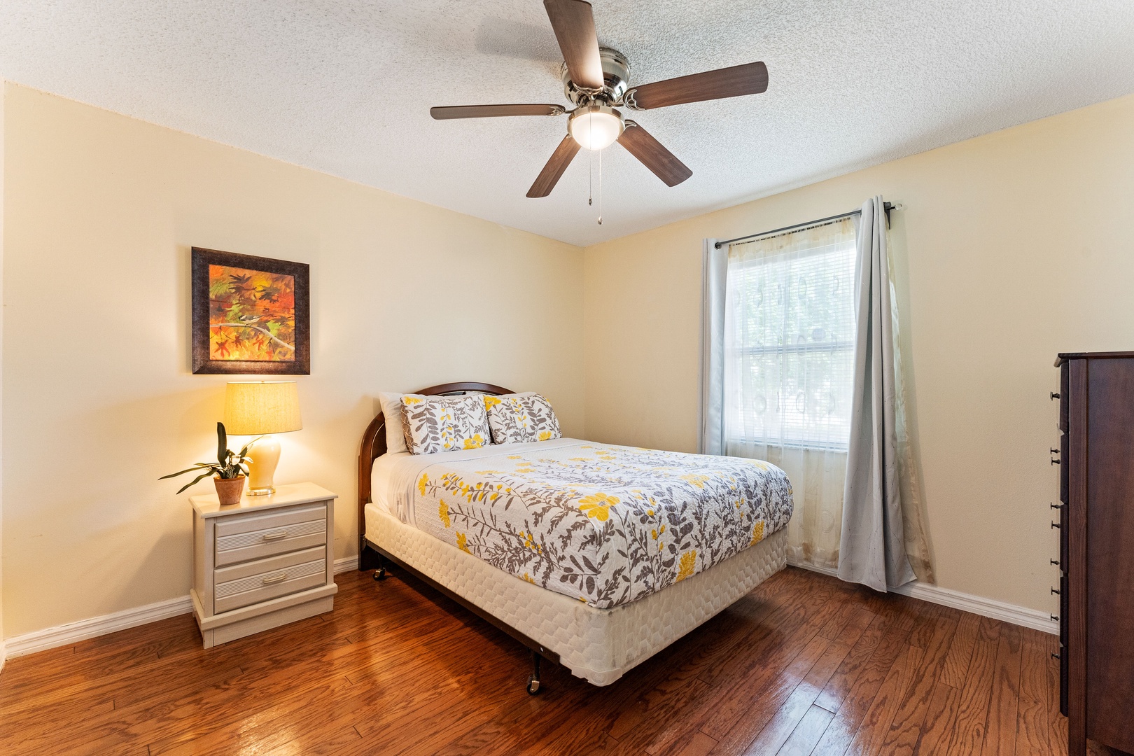 Recharge in the second bedroom sanctuary, offering a plush queen bed