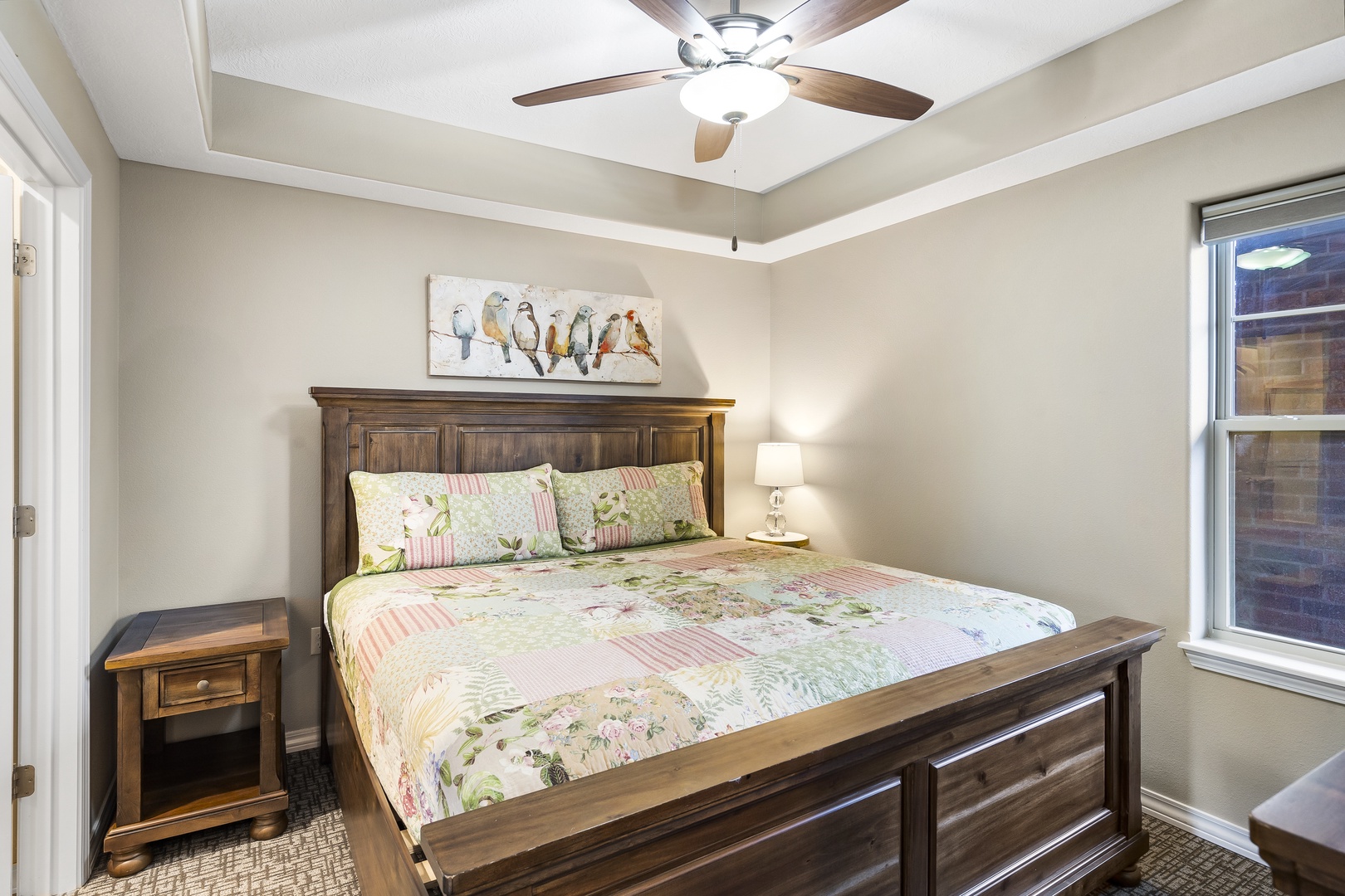 The second bedroom retreat offers a private ensuite, king bed, & Smart TV