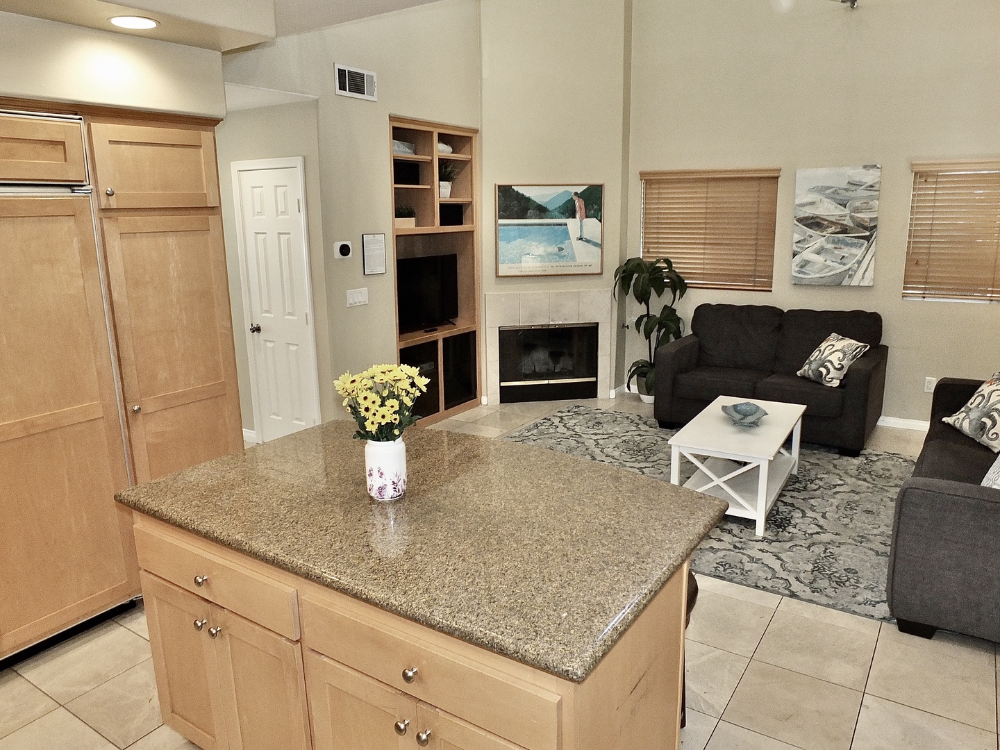 The open, airy kitchen has ample space & all the comforts of home