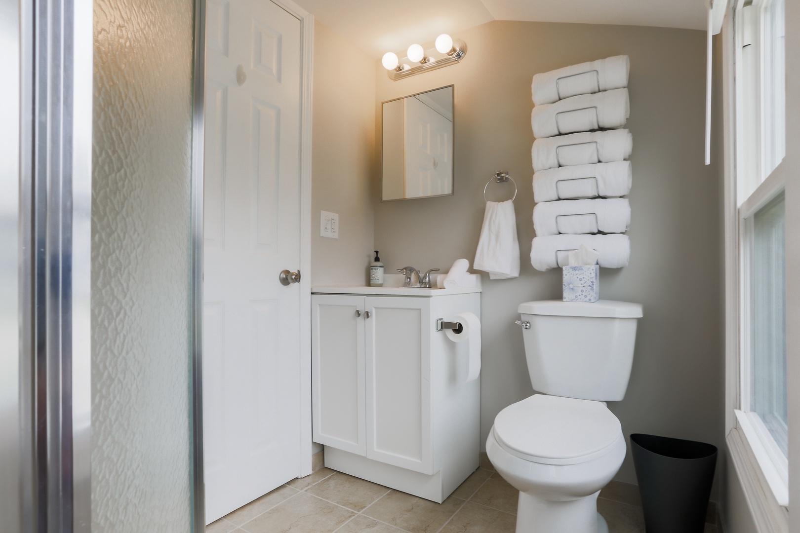 The 2nd floor full bathroom offers a single vanity and glass-enclosed shower