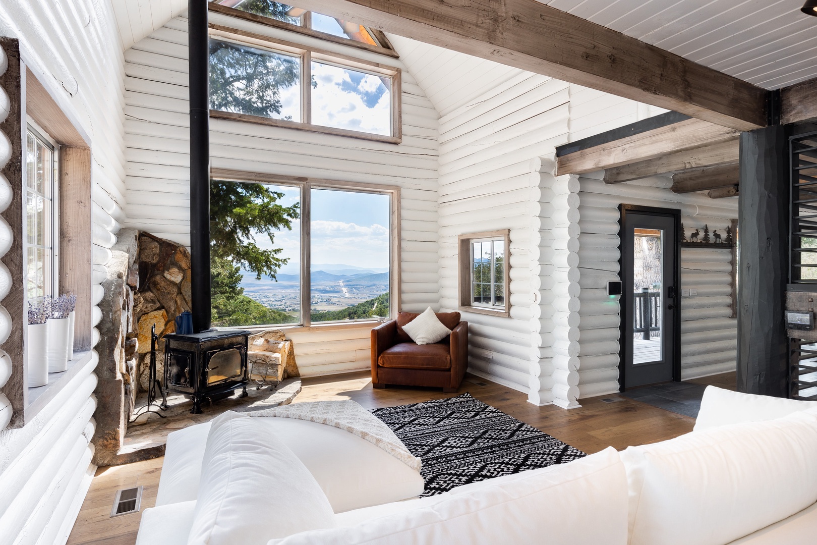 Living Room | Wood Burning Stove & Large Windows w/ Stunning Views