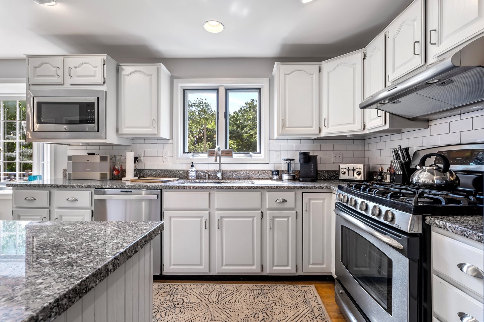 The open, airy kitchen offers ample space & all the comforts of home