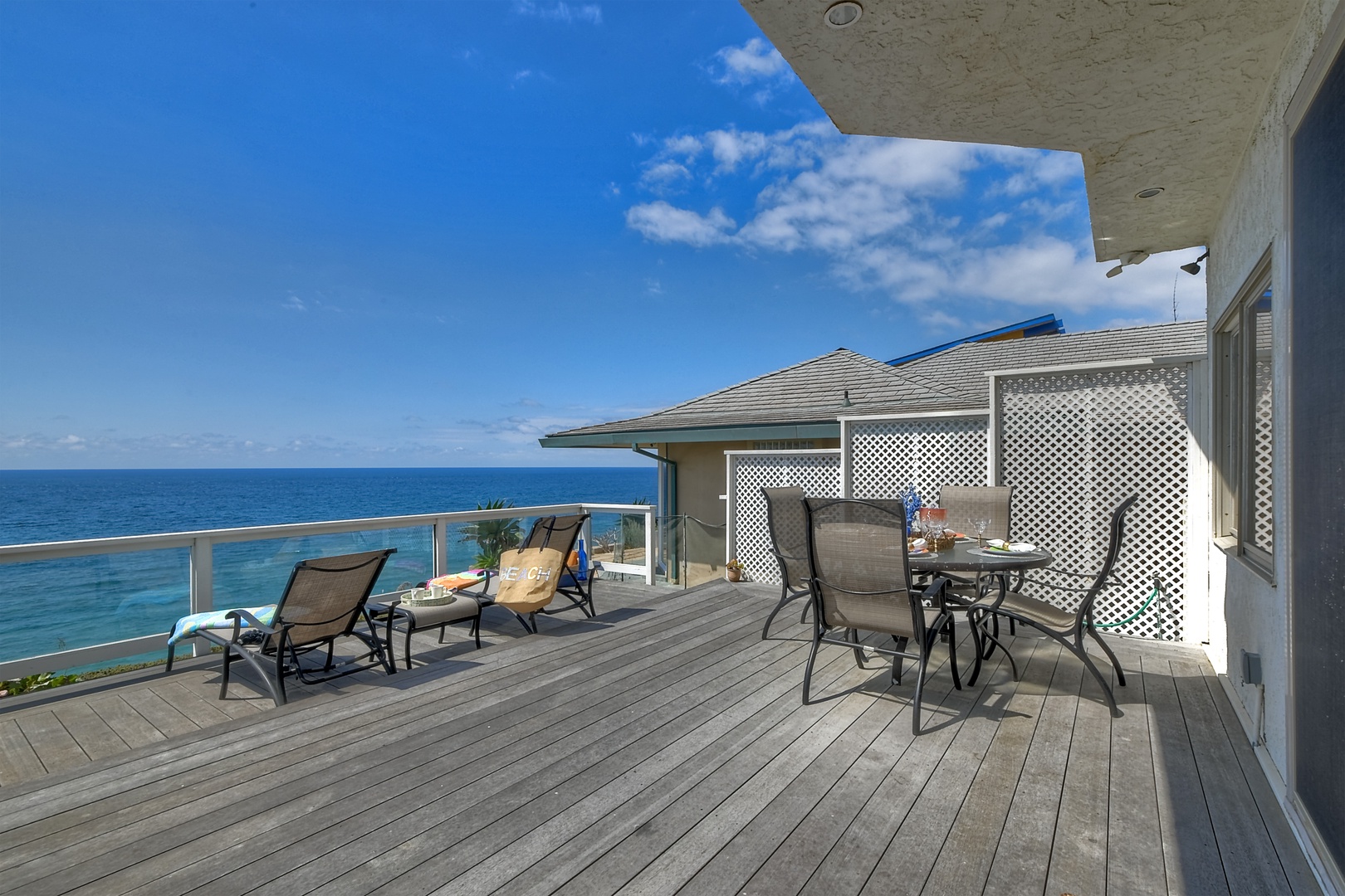 Lounge the day away or dine alfresco with ocean views on the deck