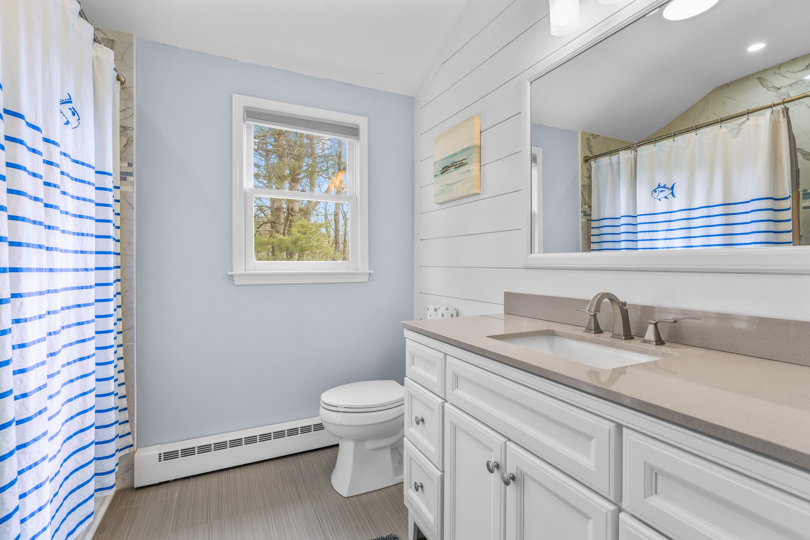 A large single vanity & shower/tub combo awaits in the 2nd-floor full bath