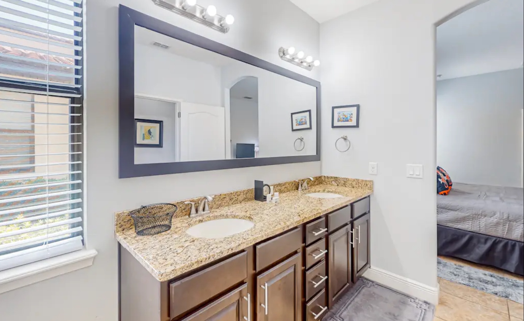 A double vanity & glass shower await in this 1st-floor ensuite