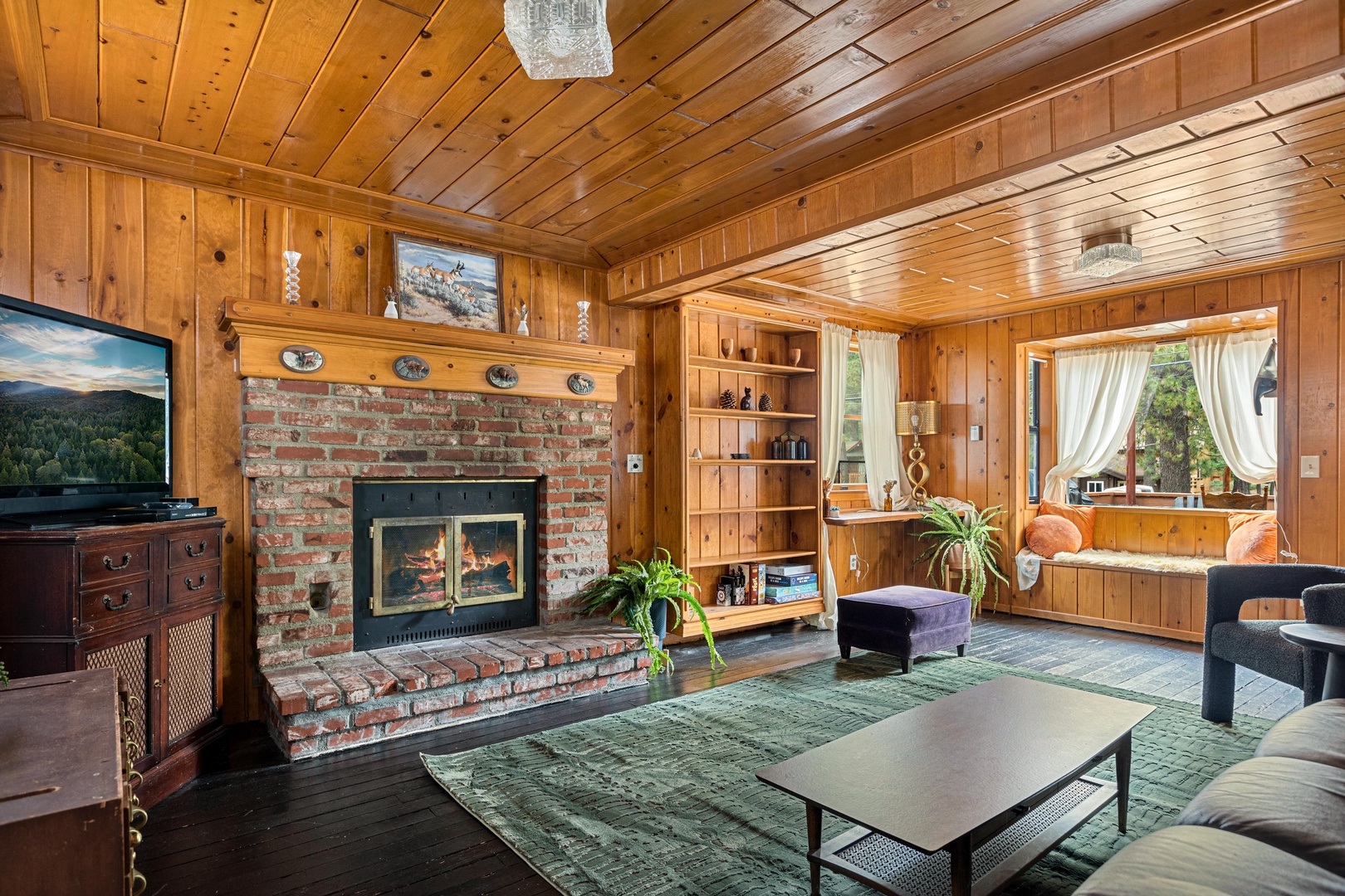 Living area with ample seating, Smart TV, and fireplace