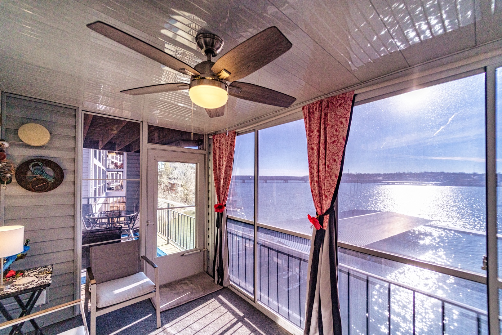 Wake up to magical lake views from the cozy enclosed deck