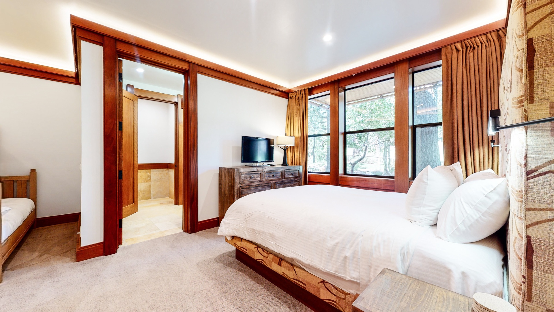 Bedroom 3 with Queen bed, Twin/Full bunk bed, TV, and en-suite (1st floor)