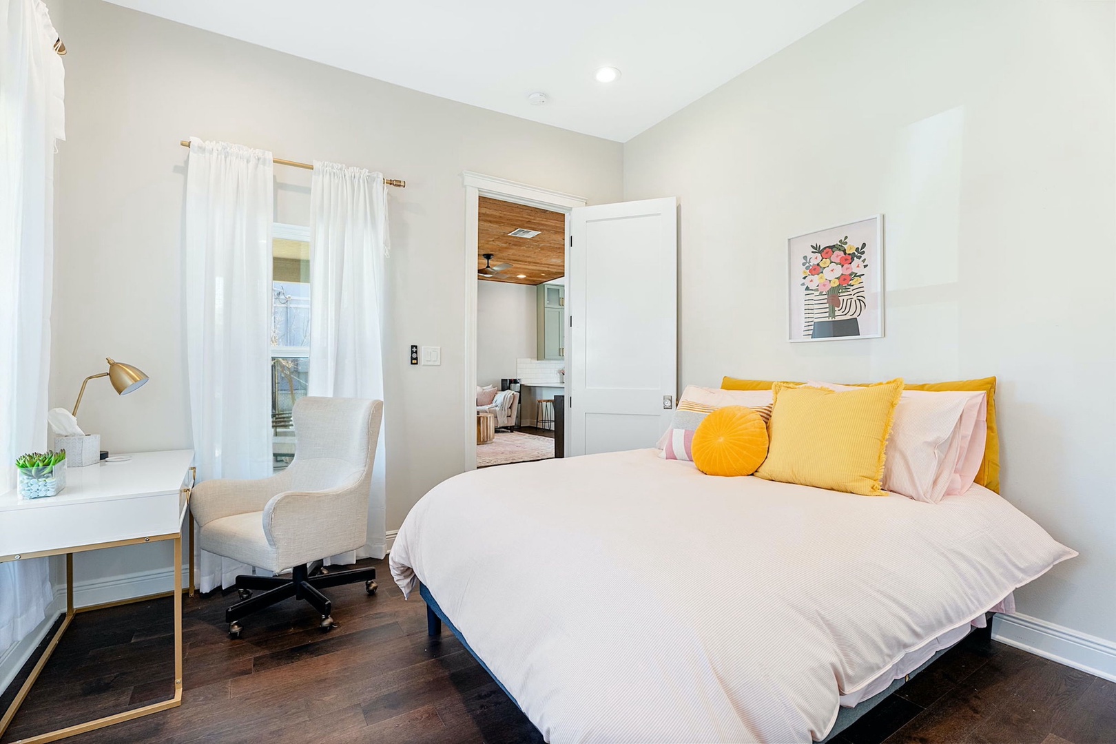 Unwind in the first bedroom, complete with queen bed, desk & closet