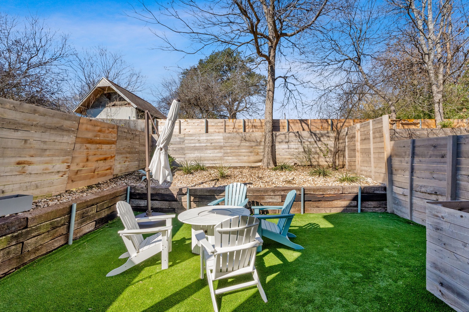 Dine alfresco or lounge by the firepit in the spacious, private back yard