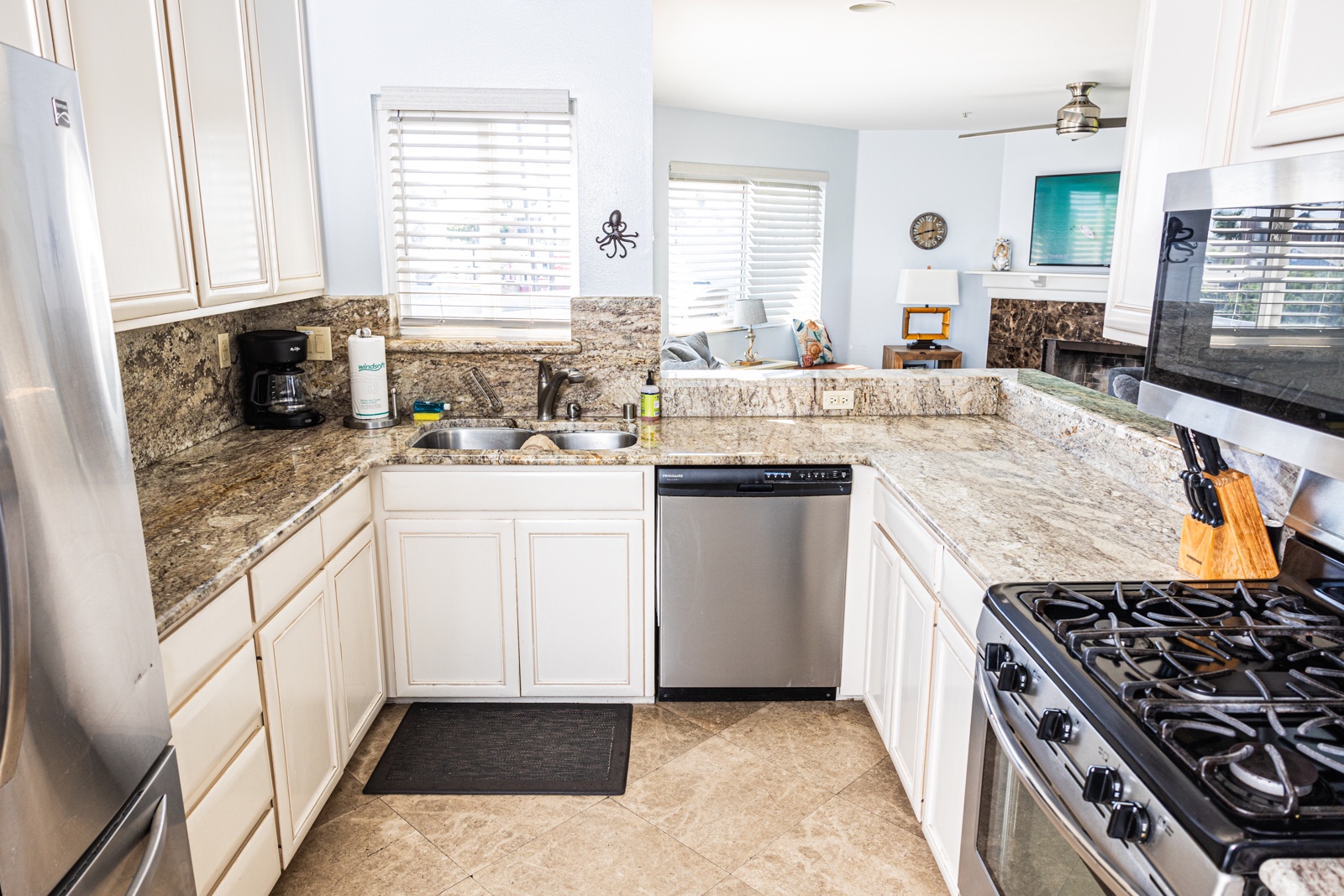 The open, airy kitchen offers ample space & every home comfort