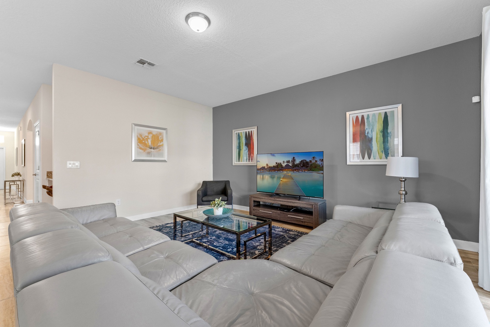 Living area with leather seating and Smart TV