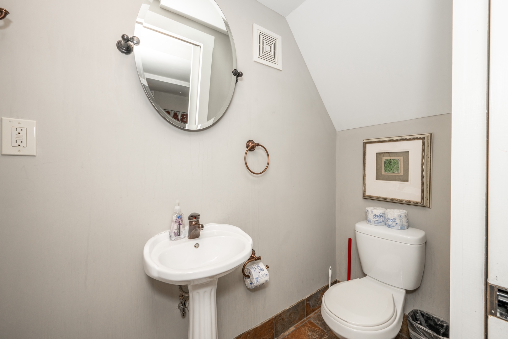 A full bath with a pedestal sink & shower is available on the lower level