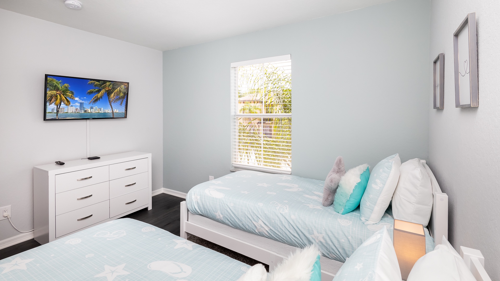 The final bedroom features a pair of cozy twin beds & Smart TV