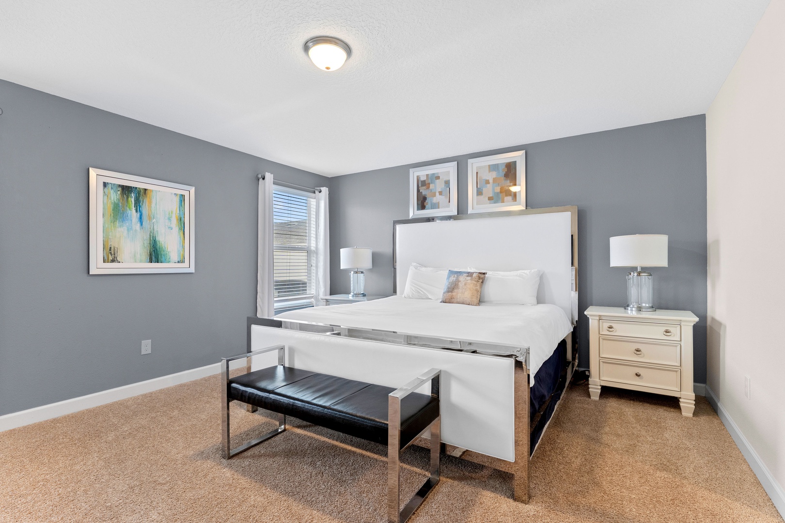 Bedroom 4 with king bed, TV, and ensuite