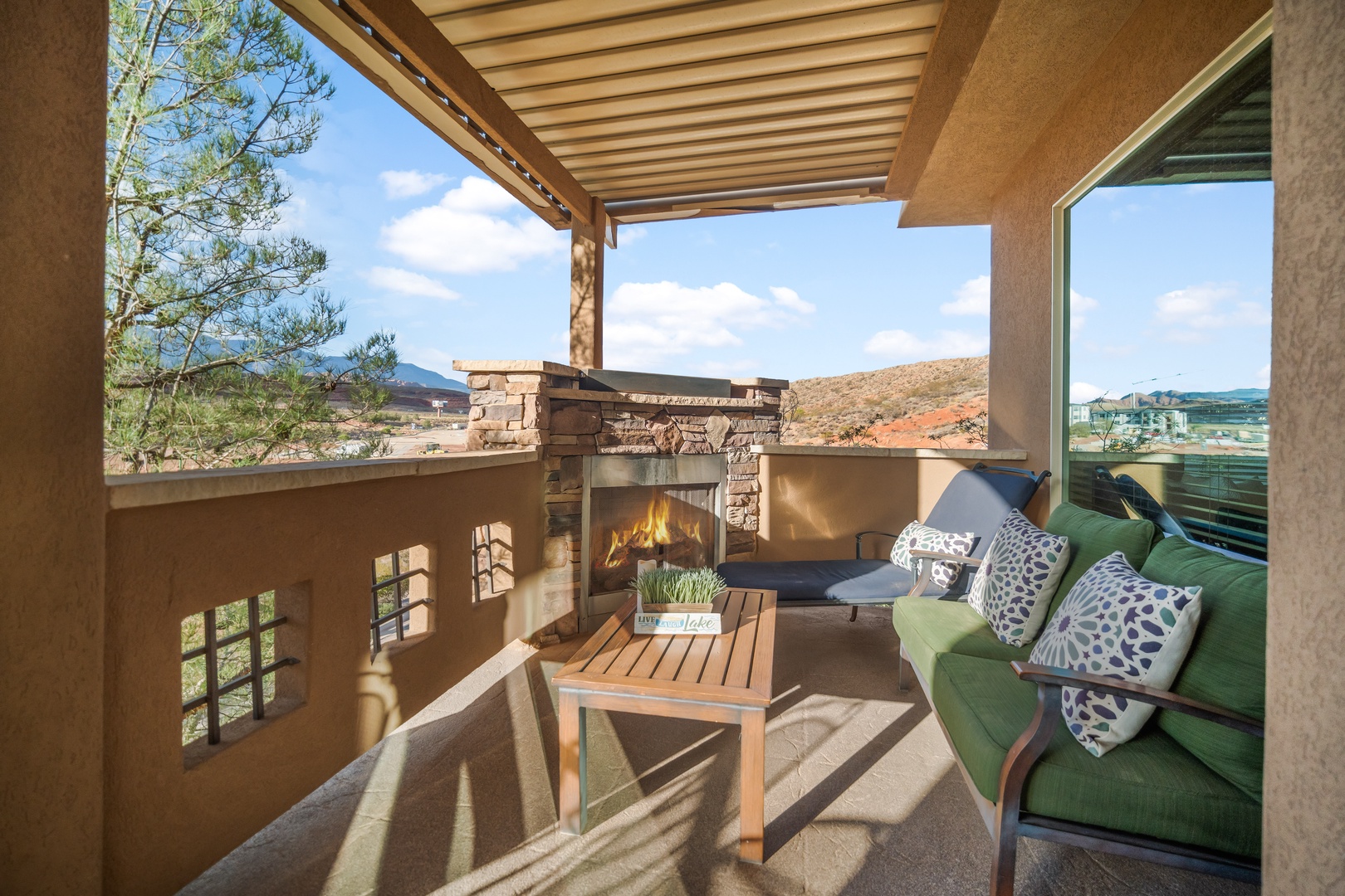 Lounge the day away with stunning views by the fireplace on the balcony