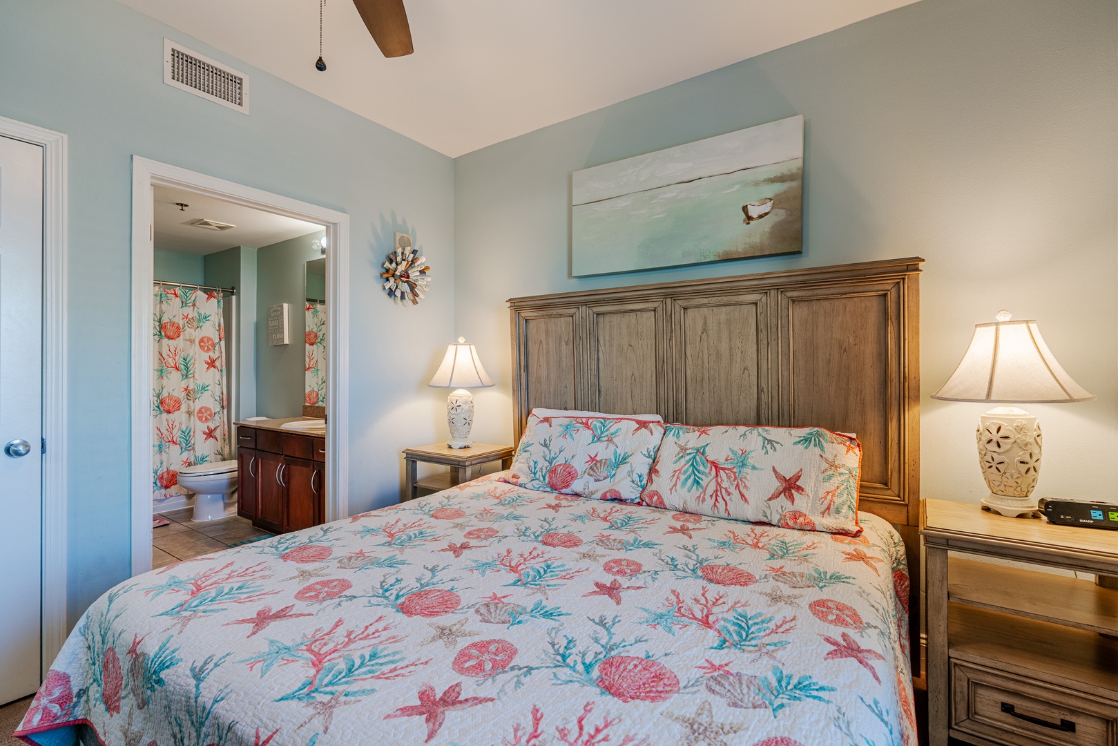 Bedroom 1- the king suite offers a private ensuite, TV, & ceiling fan