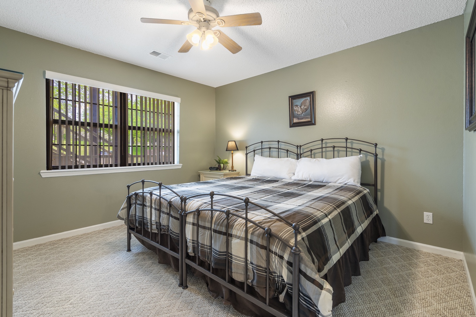 Bedroom 1 with king bed, Smart tV, and shared ensuite