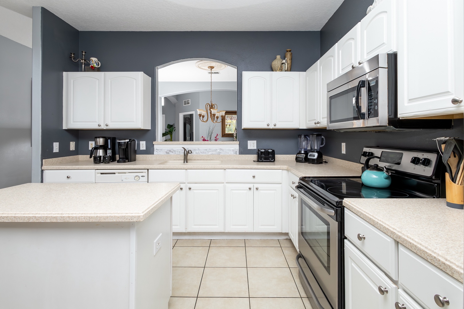 The open, airy kitchen offers ample space & all the comforts of home