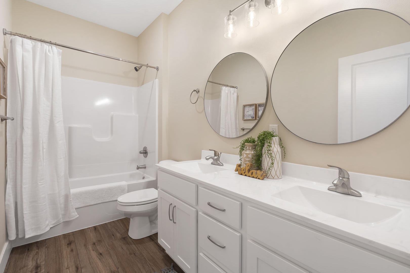 The hall Bathroom offers a spacious Double Vanity and Shower/Tub Combo