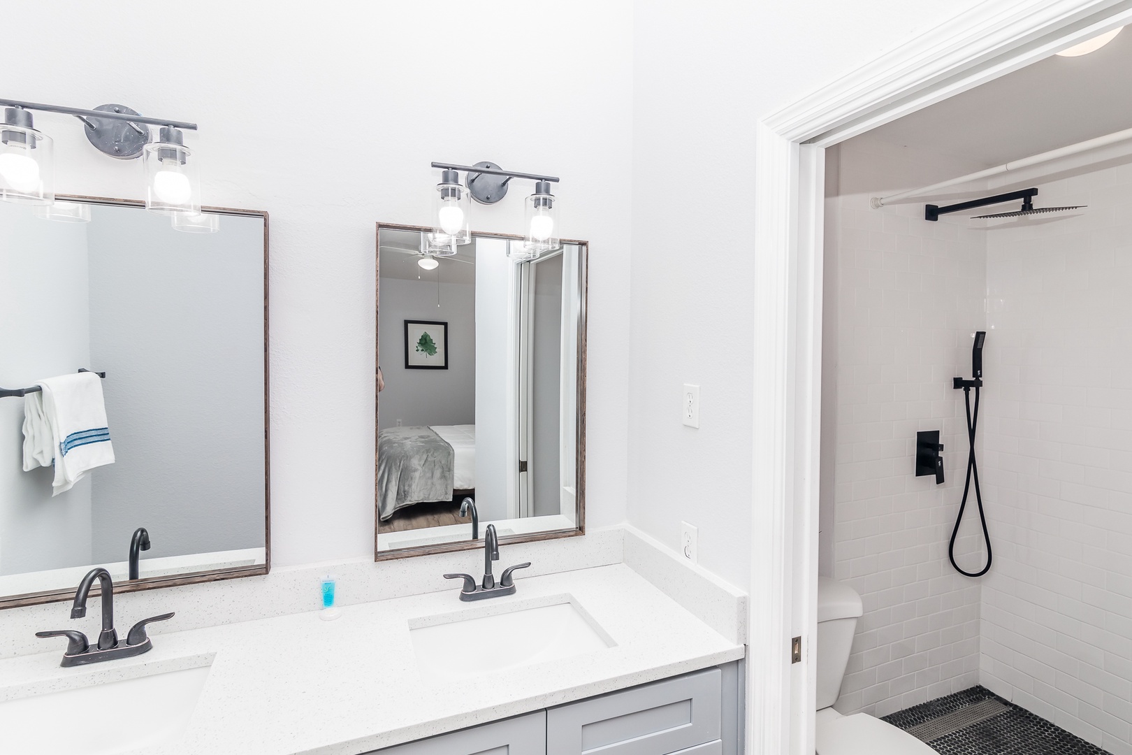 A double vanity, walk-in shower await in the ensuite bath